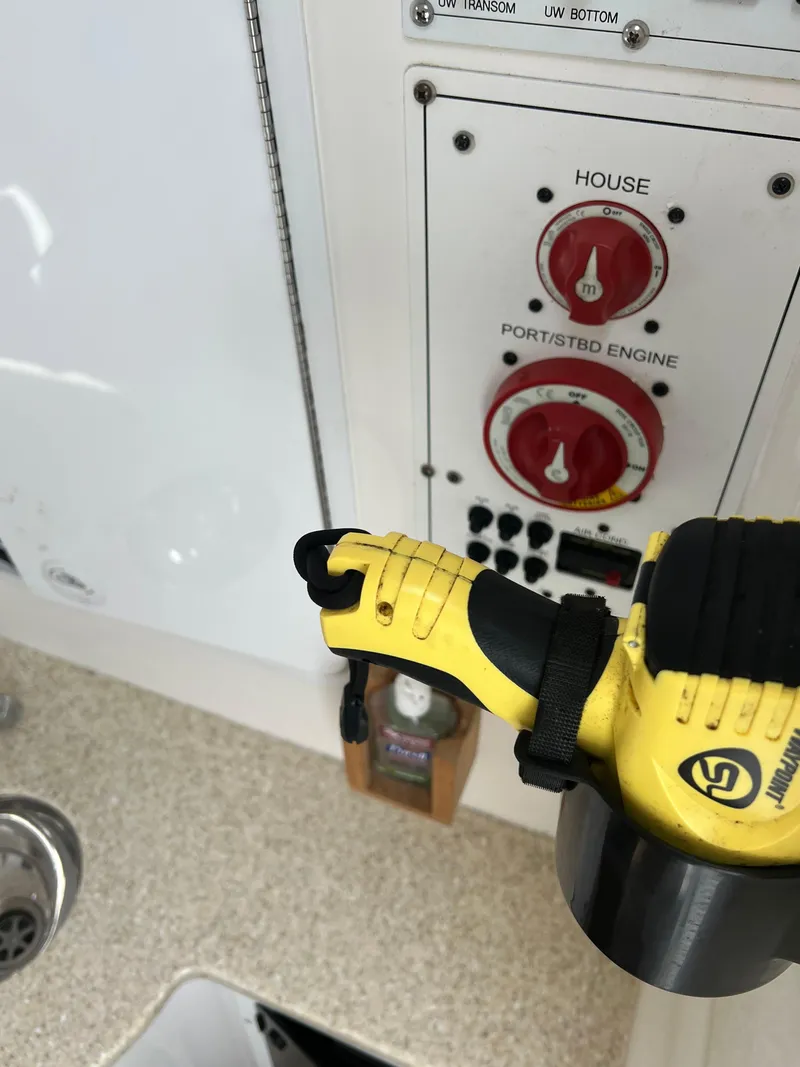 Slide: The Image of Control panel of a 2013 Regulator 34 Center Console boat with safety equipment. - 23