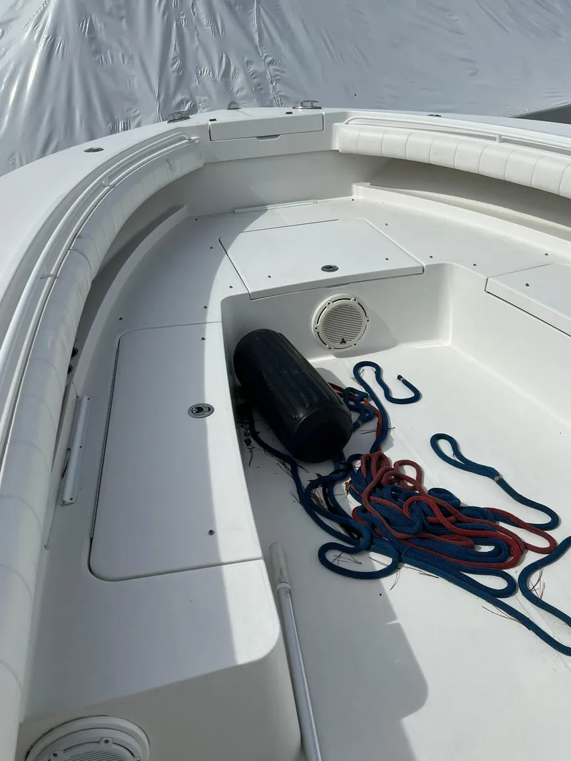 Slide: The Image of 2013 Regulator 34 Center Console boat deck with ropes and fender. - 25