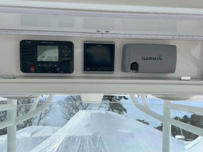 Slide: The Image of 2013 Regulator 34 Center Console electronics with Garmin navigation system. - 32