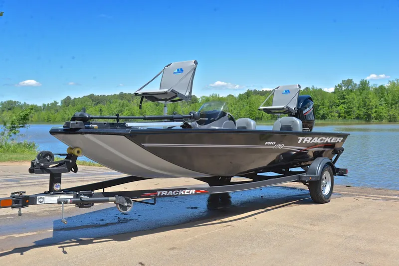 Slide: The Image of 2023 Bass Tracker Pro 170 boat on trailer by a lake, ready for fishing. - 10