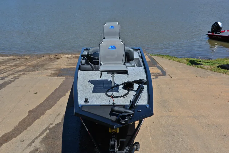 Slide: The Image of 2023 Bass Tracker Pro 170 boat on a ramp by the water. - 17