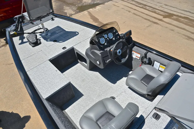 Slide: The Image of 2023 Bass Tracker Pro 170 boat interior with steering console and seating. - 22