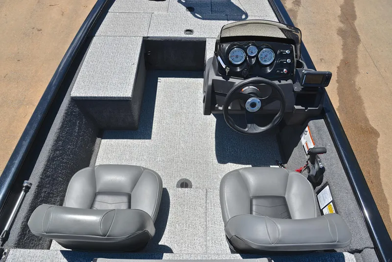 Slide: The Image of 2023 Bass Tracker Pro 170 boat interior with dual seats and steering console. - 24