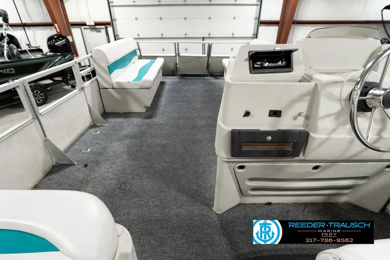 Slide: The Image of 1989 Crest 25 Savannah II pontoon boat interior with seating and steering console. - 19