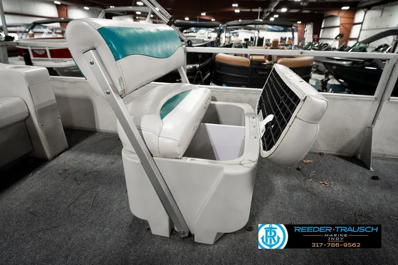 Slide: The Image of 1989 Crest 25 Savannah II boat seat with storage compartment, displayed indoors. - 23