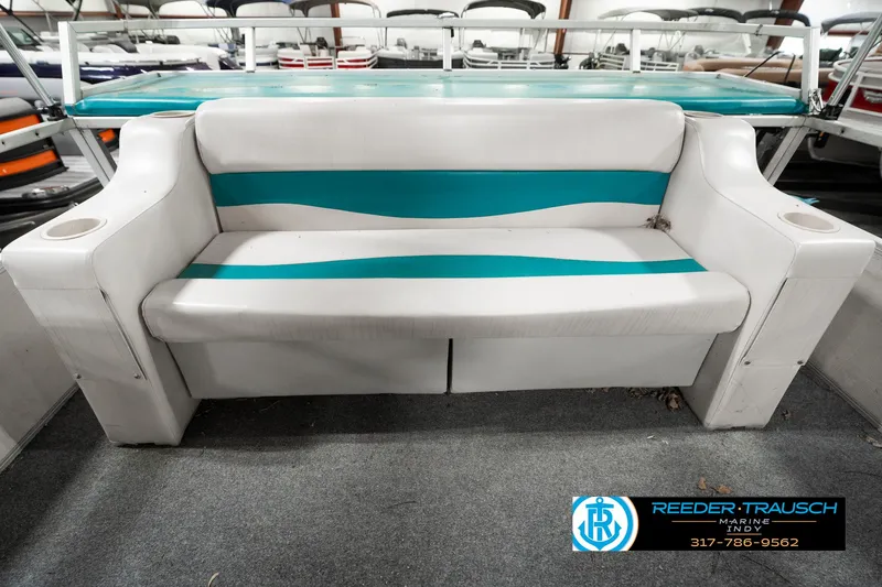 Slide: The Image of White and teal boat seat on 1989 Crest 25 Savannah II pontoon. - 26