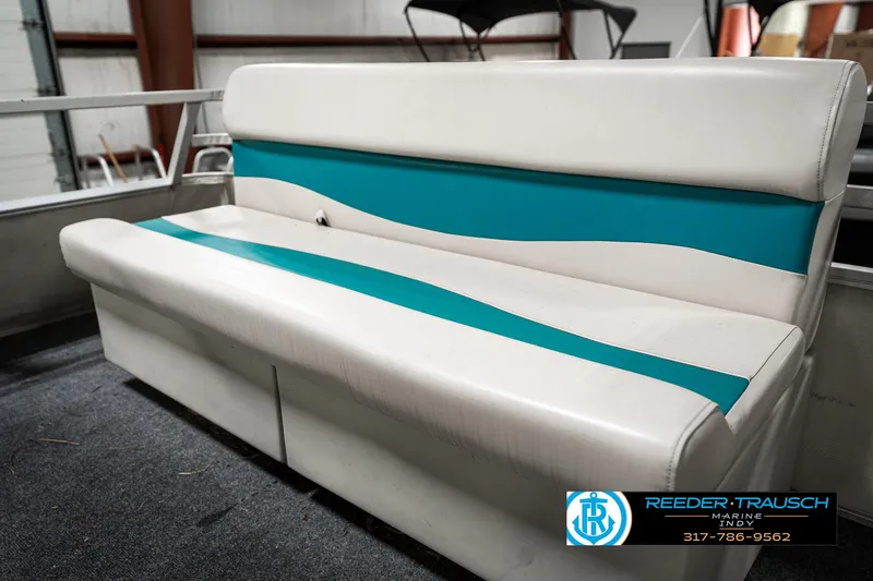 Slide: The Image of White and teal boat seat on 1989 Crest 25 Savannah II. - 33