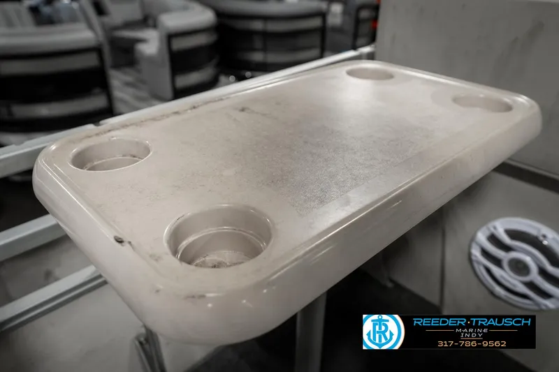 Slide: The Image of A beige boat table with cup holders on a Crest 25 Savannah II, 1989 model. - 36