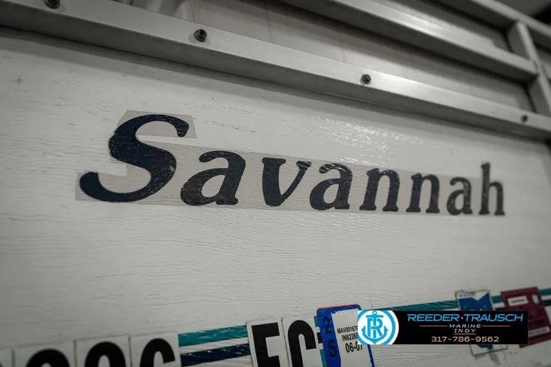 Slide: The Image of Crest 25 Savannah II 1989 boat nameplate with license plates below. - 41