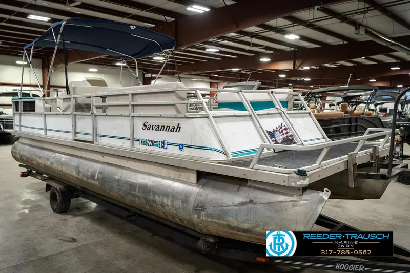 Slide: The Image of 1989 Crest 25 Savannah II pontoon boat in indoor storage facility. - 5