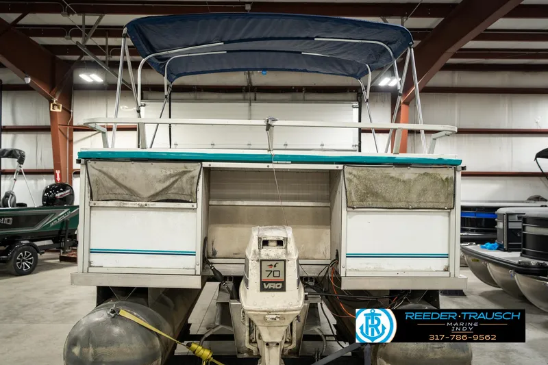 Slide: The Image of 1989 Crest 25 Savannah II pontoon boat with canopy in indoor storage. - 8