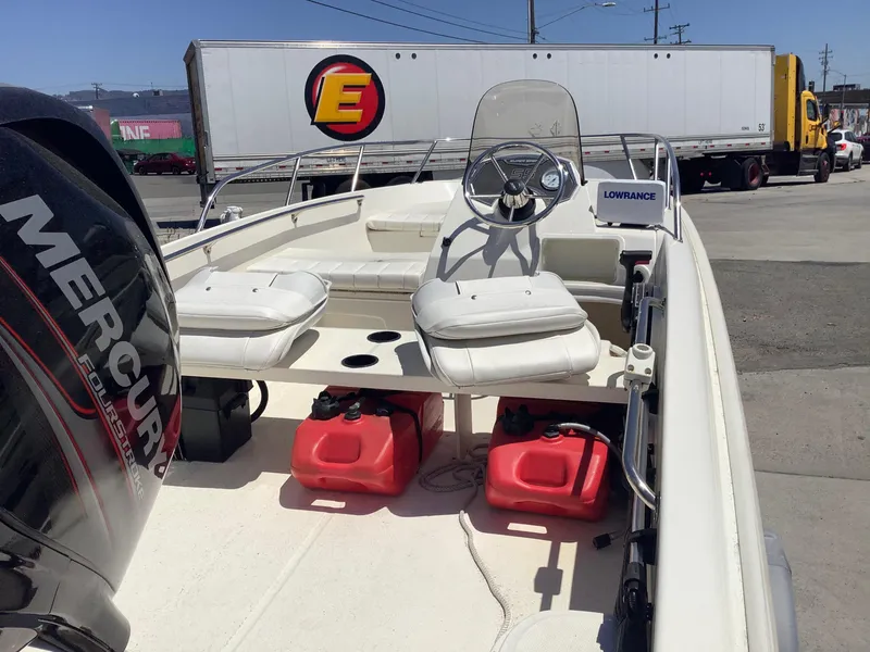 Slide: The Image of 2016 Boston Whaler 150 Super Sport boat with Mercury engine and Lowrance equipment. - 3