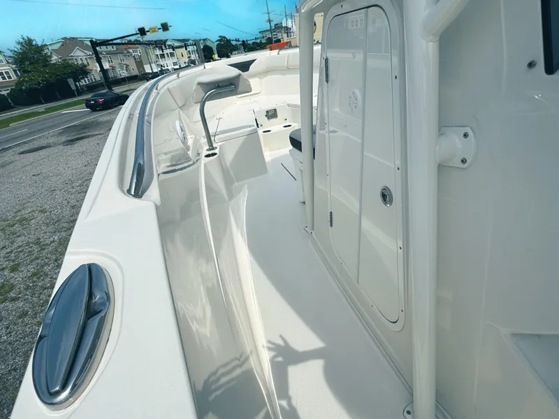 Slide: The Image of 2024 Sailfish 290 CC boat deck with sleek design and modern features. - 8