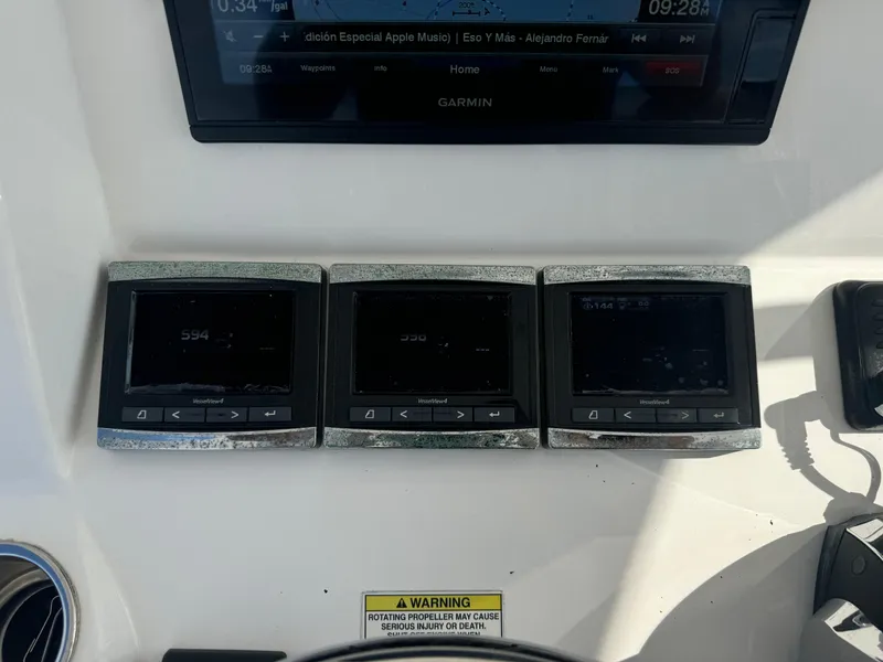 Slide: The Image of Control panel of a 2016 Intrepid 375 CC boat with multiple digital displays. - 17