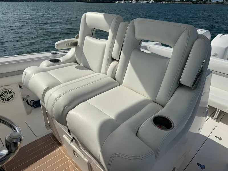 Slide: The Image of Luxurious seating on 2016 Intrepid 375 CC boat with ocean backdrop. - 18