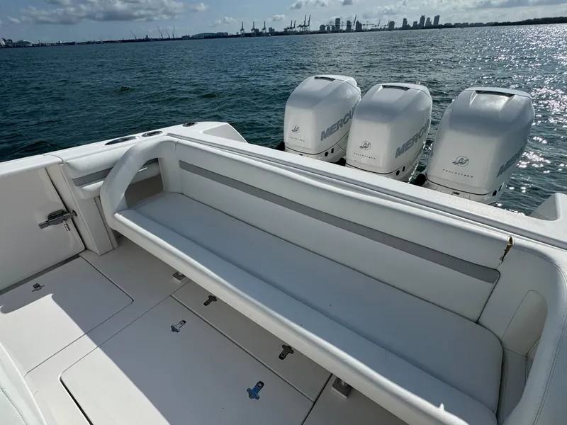 Slide: The Image of 2016 Intrepid 375 CC boat with triple Mercury engines on open water. - 21
