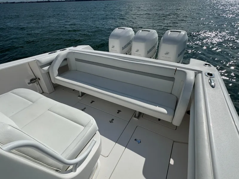 Slide: The Image of 2016 Intrepid 375 CC boat with seating and triple Mercury outboard engines on the water. - 24
