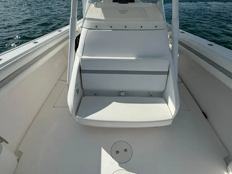 Slide: The Image of 2016 Intrepid 375 CC boat interior with seating, on calm water. - 36