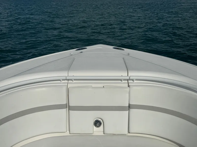 Slide: The Image of Bow of a 2016 Intrepid 375 CC boat on calm water. - 43