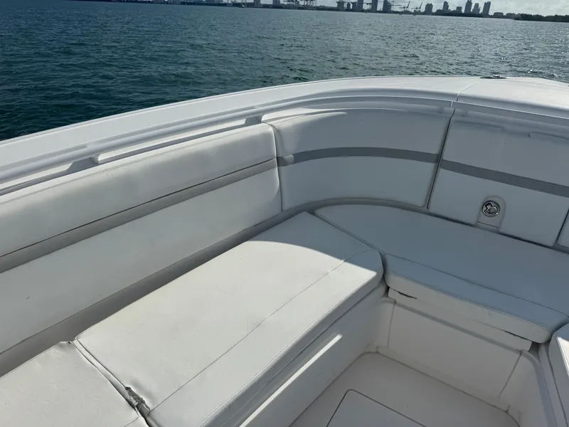Slide: The Image of 2016 Intrepid 375 CC boat with white seating, ocean view in background. - 45