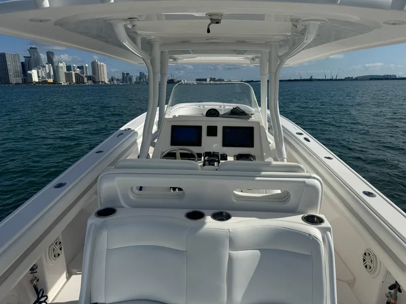 Slide: The Image of 2016 Intrepid 375 CC boat interior with city skyline in background. - 7