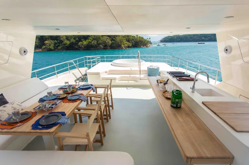 Slide: The Image of Luxurious Inace Explora 90 yacht deck with dining area and ocean view, 2027 model. - 10