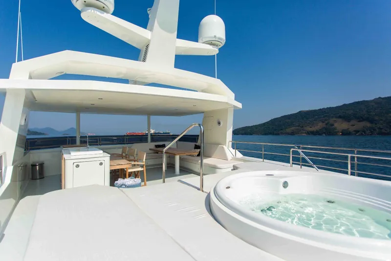Slide: The Image of Luxurious 2027 Inace Explora 90 yacht deck with jacuzzi, ocean view, and modern amenities. - 13