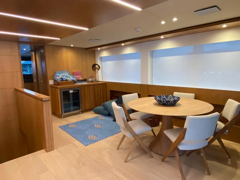 Slide: The Image of Luxurious interior of 2027 Inace Explora 90 yacht with modern dining area and elegant decor. - 16