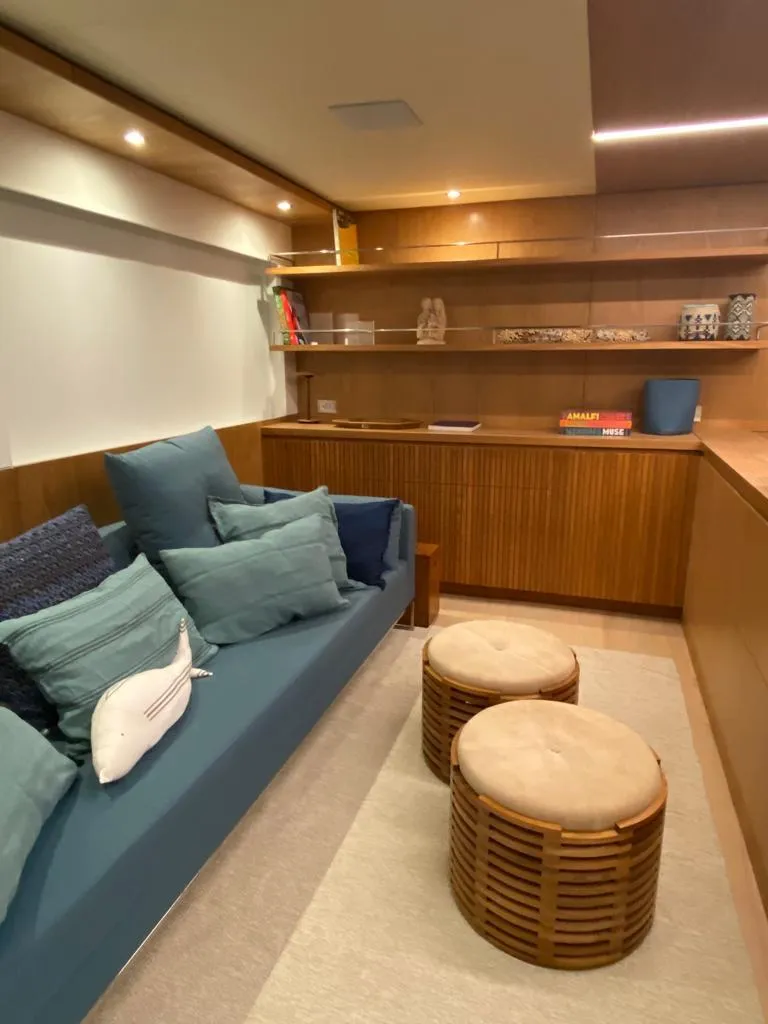 Slide: The Image of Luxurious interior of 2027 Inace Explora 90 yacht with cozy seating and elegant wooden decor. - 18