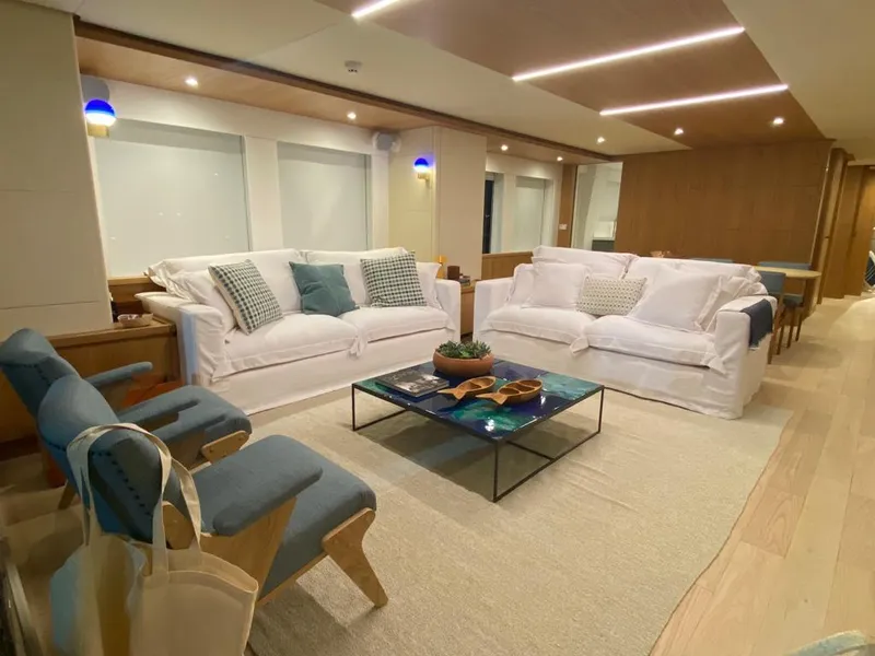 Slide: The Image of Luxurious interior of 2027 Inace Explora 90 yacht with elegant seating and modern decor. - 23