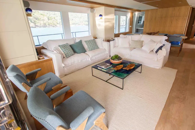 Slide: The Image of Luxurious Inace Explora 90 yacht interior with elegant seating and scenic window views, 2027 model. - 26