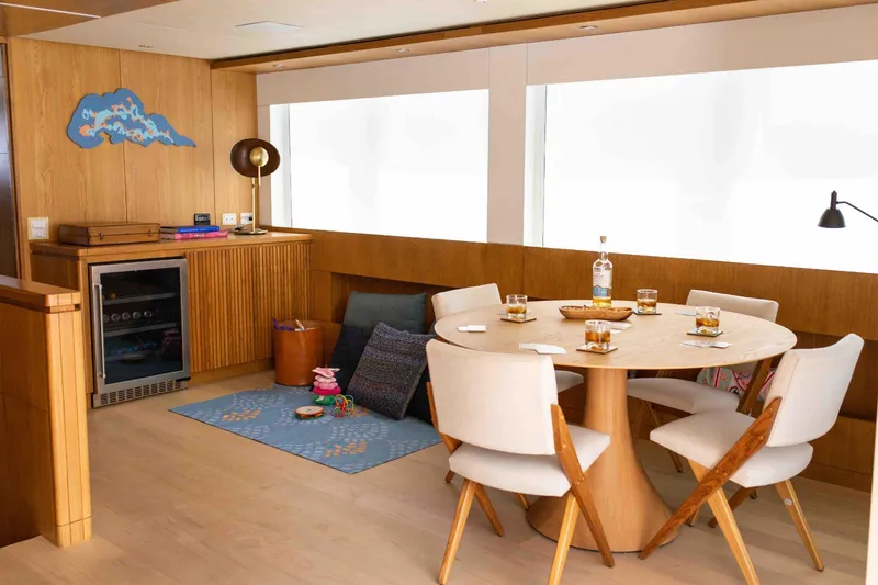 Slide: The Image of Luxurious interior of 2027 Inace Explora 90 yacht with dining area and modern decor. - 28