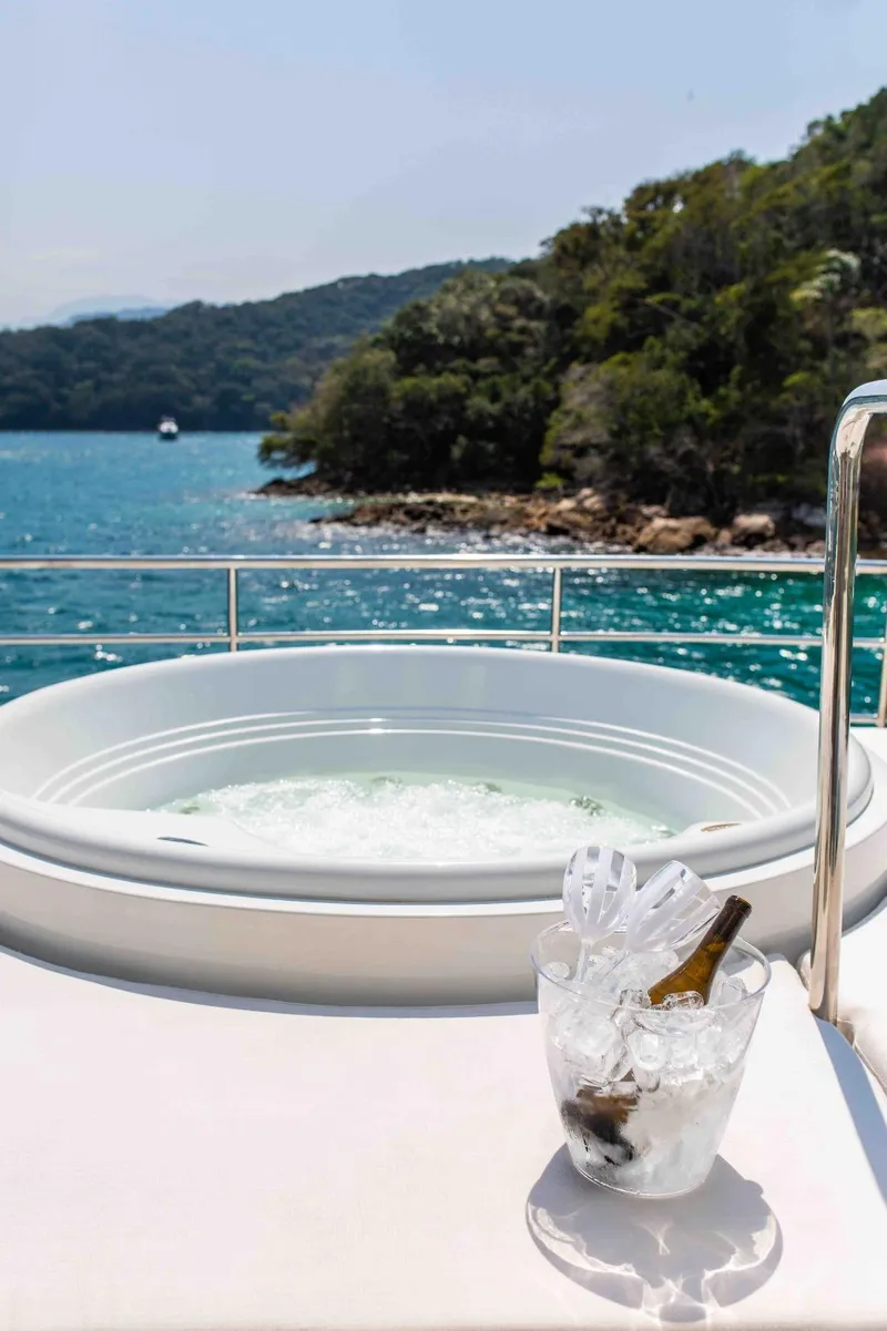 Slide: The Image of Luxury yacht Inace Explora 90 with jacuzzi and champagne, scenic ocean view, 2027 model. - 15