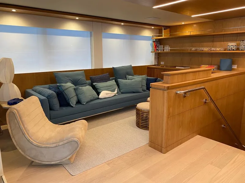 Slide: The Image of Luxurious interior of 2027 Inace Explora 90 yacht with modern seating and wooden accents. - 17