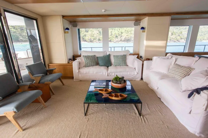 Slide: The Image of Luxurious interior of 2027 Inace Explora 90 yacht with elegant seating and scenic views. - 27