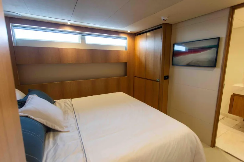 Slide: The Image of Luxurious bedroom interior of 2027 Inace Explora 90 yacht with modern design and wooden accents. - 36