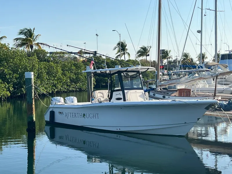The Image of 2022 Sea Hunt Gamefish 30 Coffin Box boat docked under clear blue sky. - 0