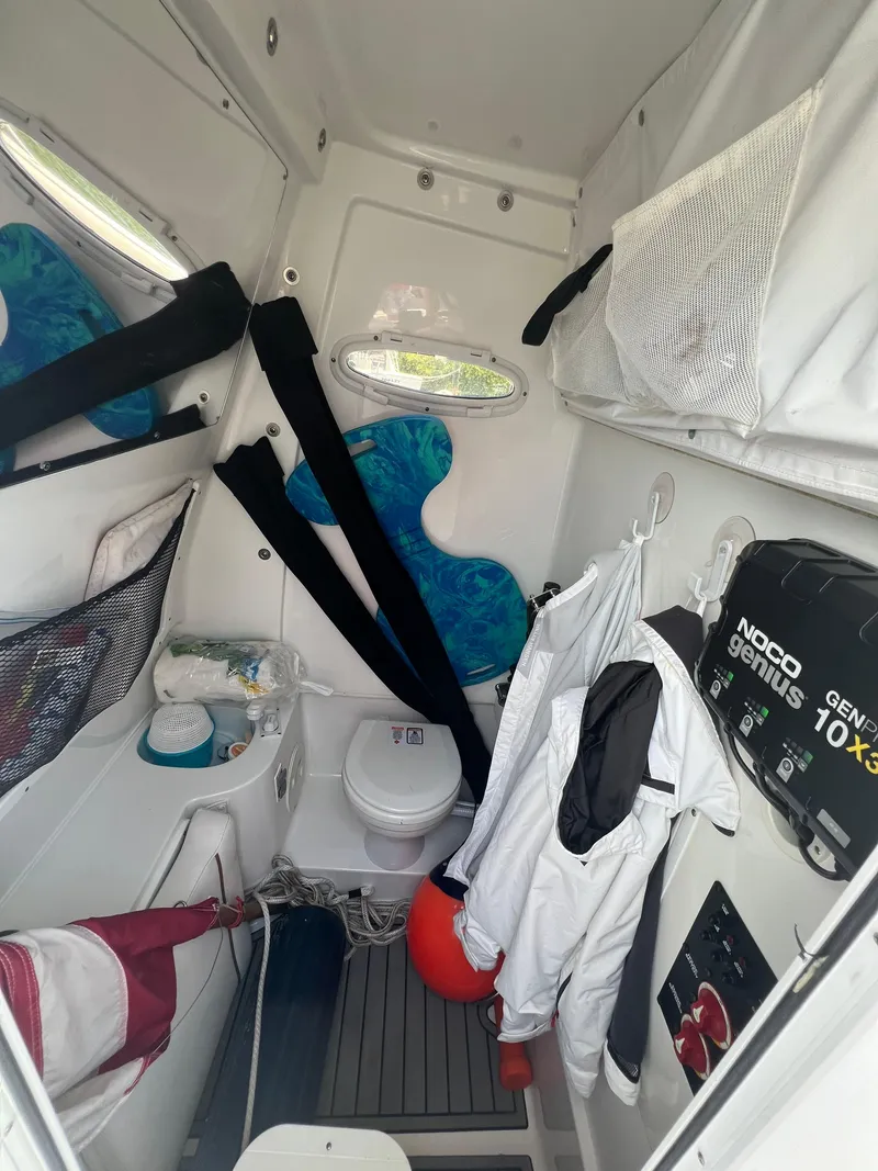 Slide: The Image of 2022 Sea Hunt Gamefish 30 Coffin Box boat interior with helm and electronics. - 12