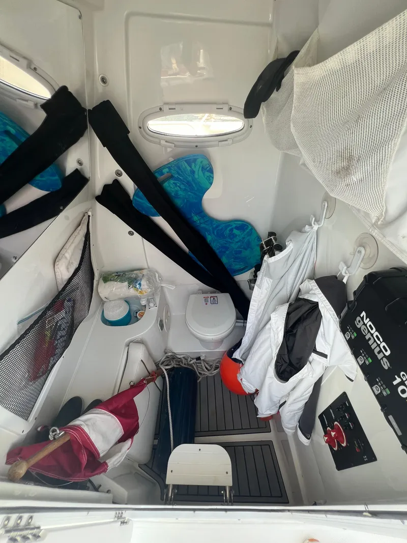 Slide: The Image of 2022 Sea Hunt Gamefish 30 Coffin Box helm with dual screens and steering wheel. - 13