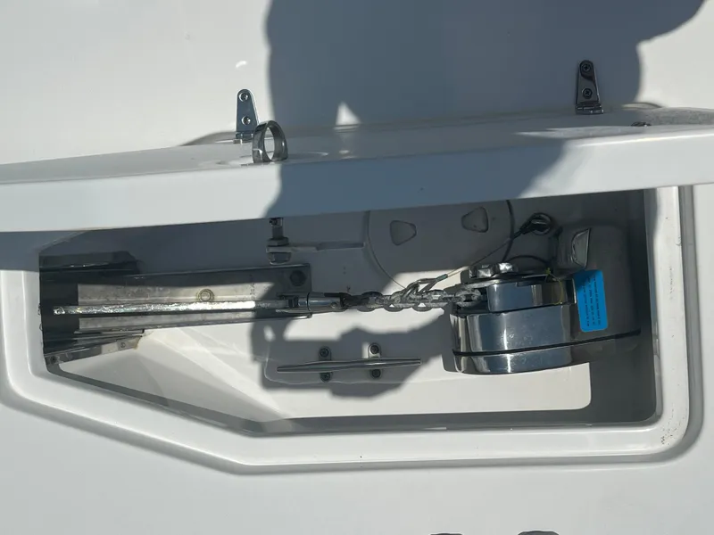 Slide: The Image of 2022 Sea Hunt Gamefish 30 with twin Yamaha outboard motors docked by a marina. - 20