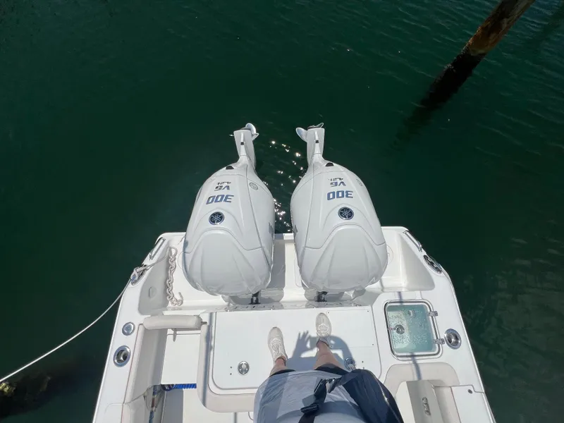 Slide: The Image of Interior of 2022 Sea Hunt Gamefish 30 Coffin Box boat, featuring compact bathroom amenities. - 22