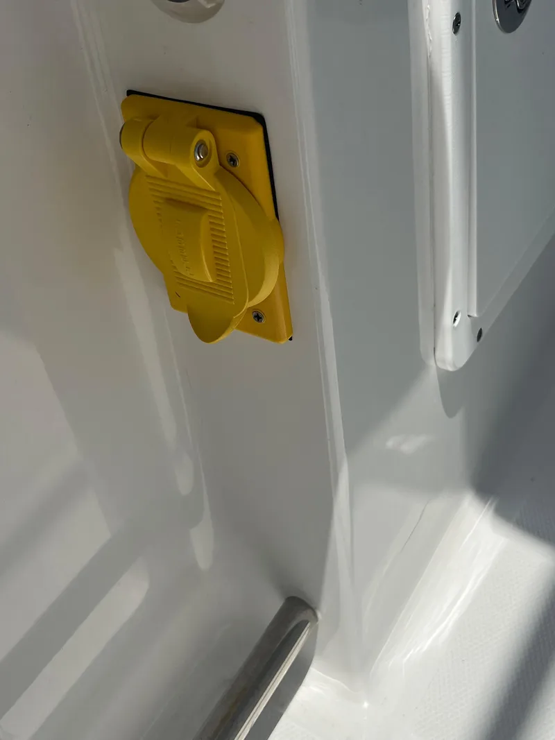 Slide: The Image of 2022 Sea Hunt Gamefish 30 Coffin Box with open storage, docked near palm trees. - 26