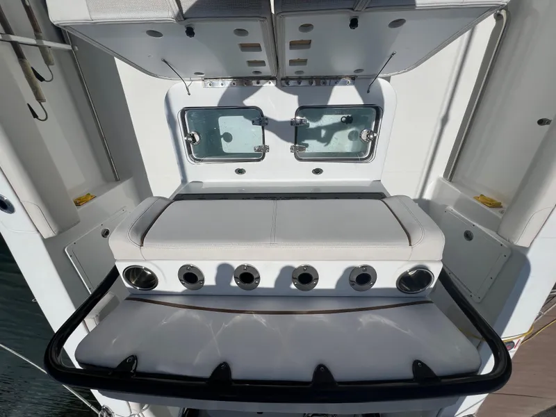 Slide: The Image of 2022 Sea Hunt Gamefish 30 Coffin Box boat docked under blue sky. - 7