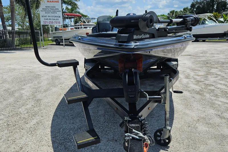 Slide: The Image of 2023 Phoenix 721 ProXP boat on trailer, featuring MotorGuide trolling motor. - 15
