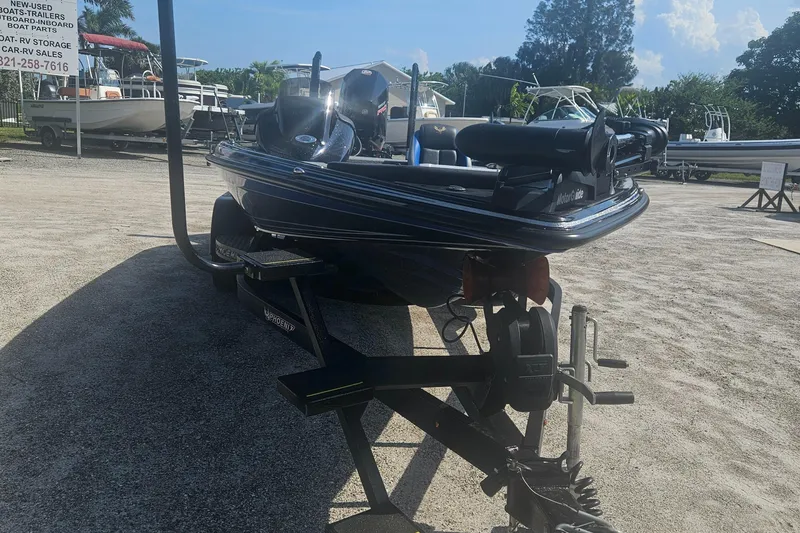 Slide: The Image of 2023 Phoenix 721 ProXP boat on trailer in sunny outdoor setting. - 17