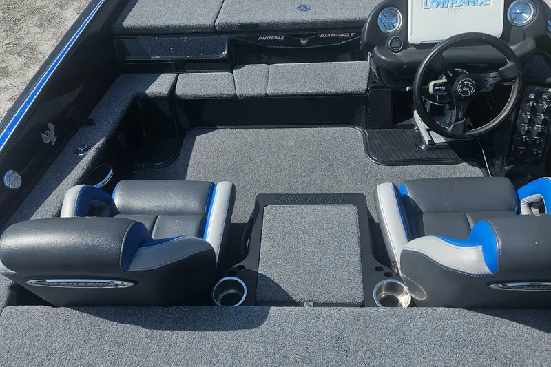 Slide: The Image of 2023 Phoenix 721 ProXP boat interior with dual seats and steering console. - 18
