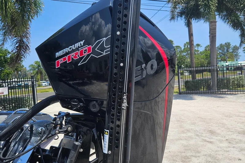 Slide: The Image of 2023 Phoenix 721 ProXP with Mercury Pro XS engine, outdoor setting with palm trees. - 20