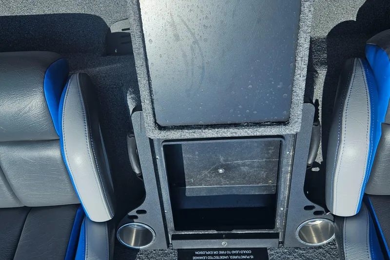 Slide: The Image of 2023 Phoenix 721 ProXP interior with storage compartment and cup holders. - 22