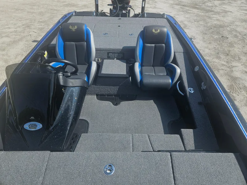 Slide: The Image of 2023 Phoenix 721 ProXP boat interior with dual seats and steering console. - 4
