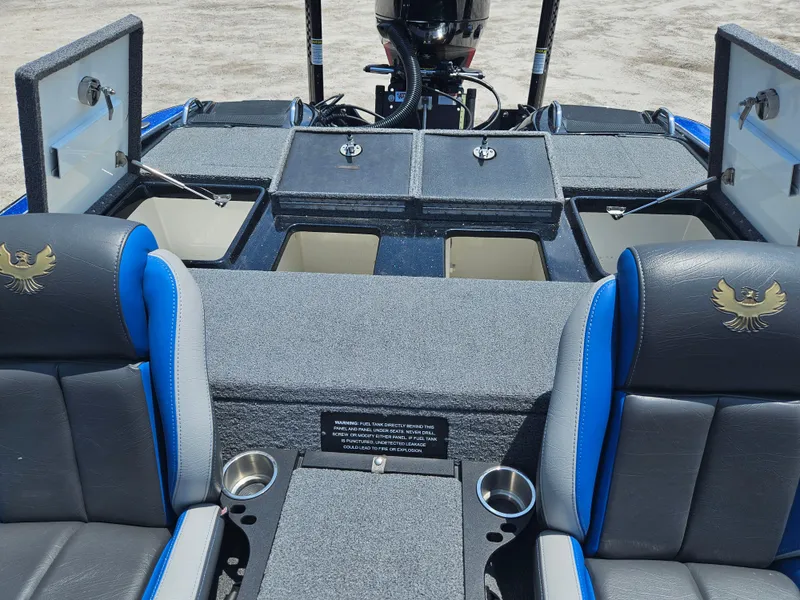 Slide: The Image of 2023 Phoenix 721 ProXP boat interior with storage compartments and seating. - 5